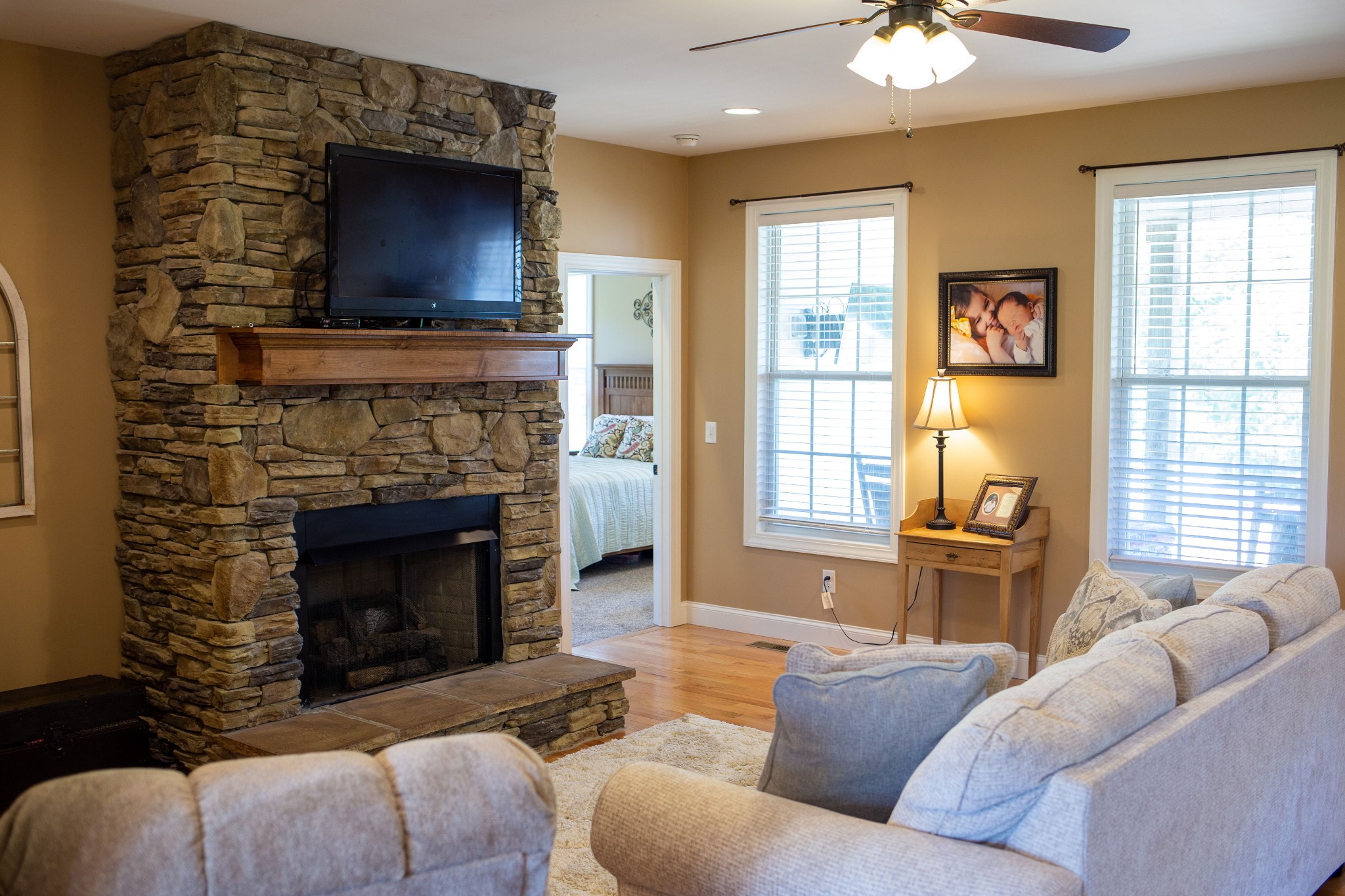 310 Freeland Road Portland, TN 37148 - Photo 17 of 31 a living room with furniture a flat screen tv and a fireplace