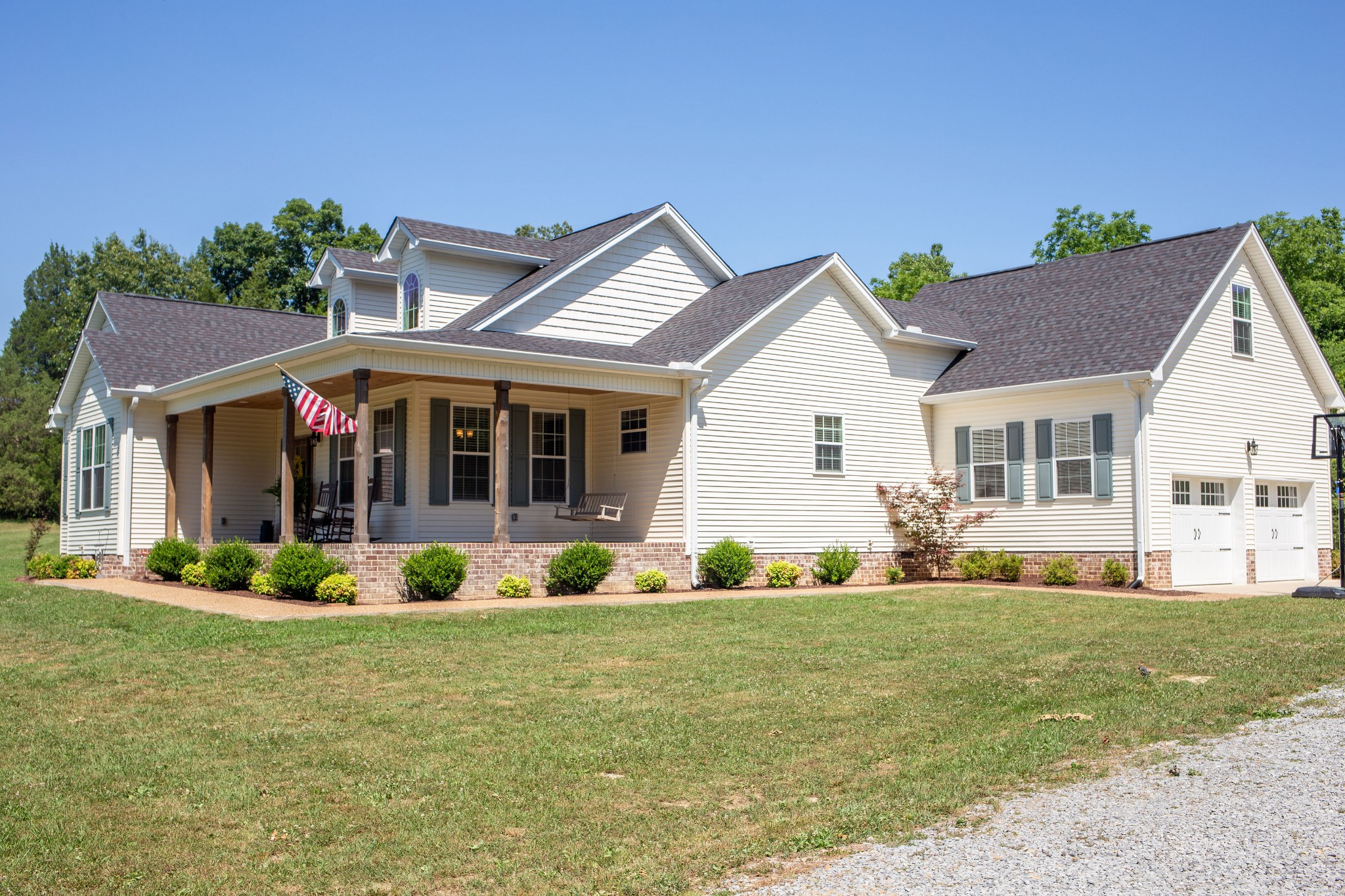310 Freeland Road Portland, TN 37148 - Photo 6 of 31 a front view of a house with a garden and porch
