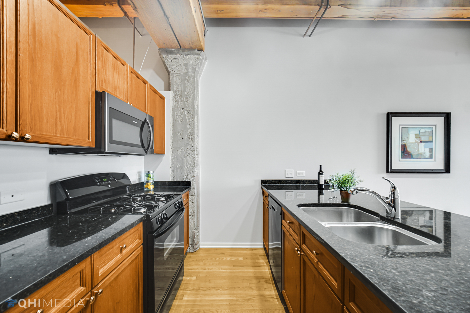 333 South Desplaines Street, Unit 314 Chicago, IL 60661 - Photo 11 of 22 a kitchen that has a sink and a stove