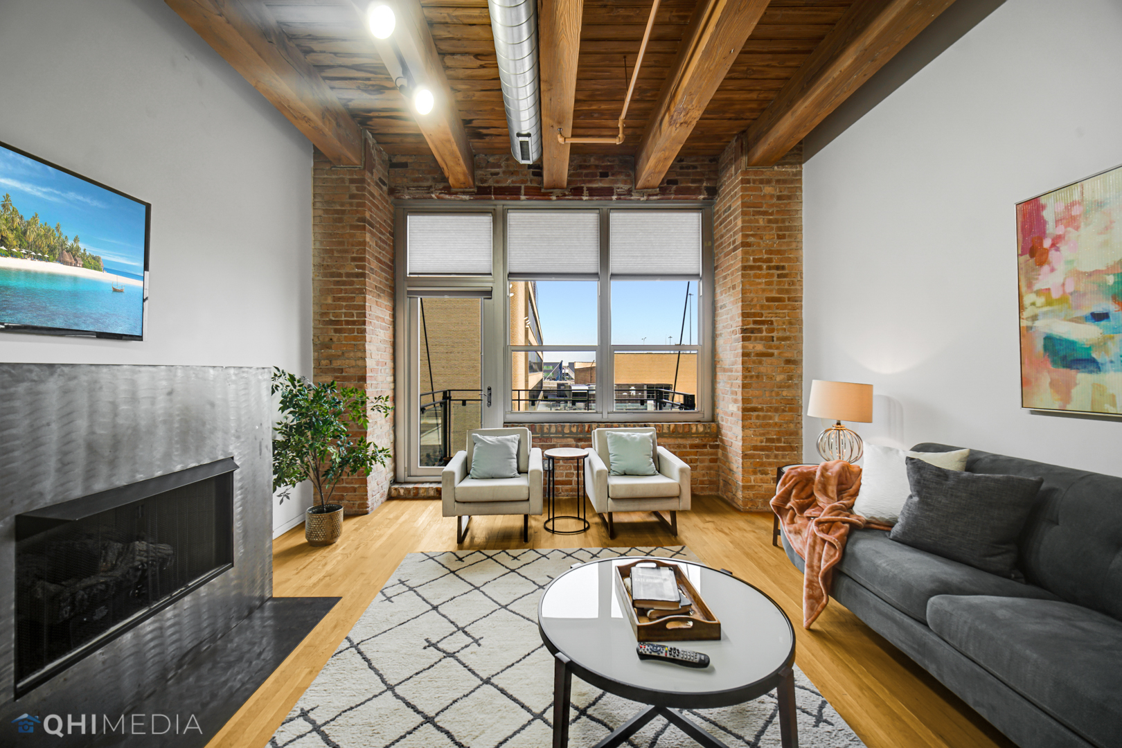 333 South Desplaines Street, Unit 314 Chicago, IL 60661 - Photo 12 of 22 a living room with furniture or couch and a fireplace