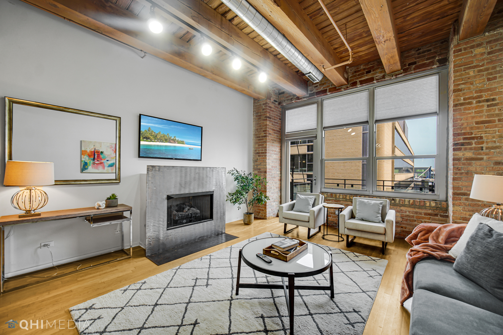 333 South Desplaines Street, Unit 314 Chicago, IL 60661 - Photo 13 of 22 a living room with furniture and a fireplace