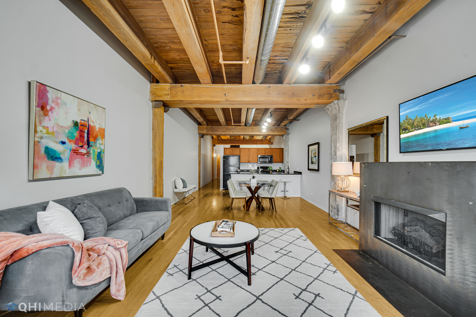 333 South Desplaines Street, Unit 314 Chicago, IL 60661 - Photo 14 of 22 a living room with furniture and a fireplace