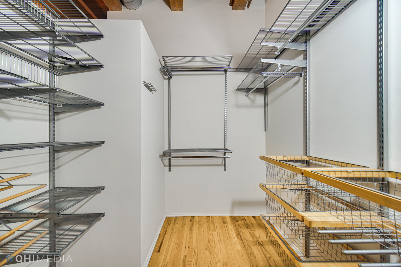 333 South Desplaines Street, Unit 314 Chicago, IL 60661 - Photo 17 of 22 a view of a room with racks on the wall