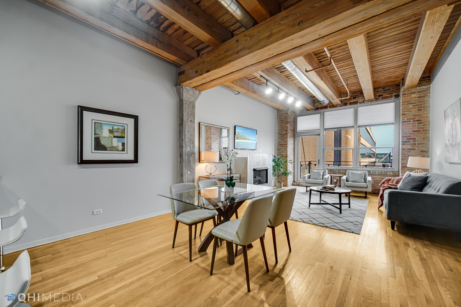 333 South Desplaines Street, Unit 314 Chicago, IL 60661 - Photo 5 of 22 a view of a dining room with furniture window and wooden floor