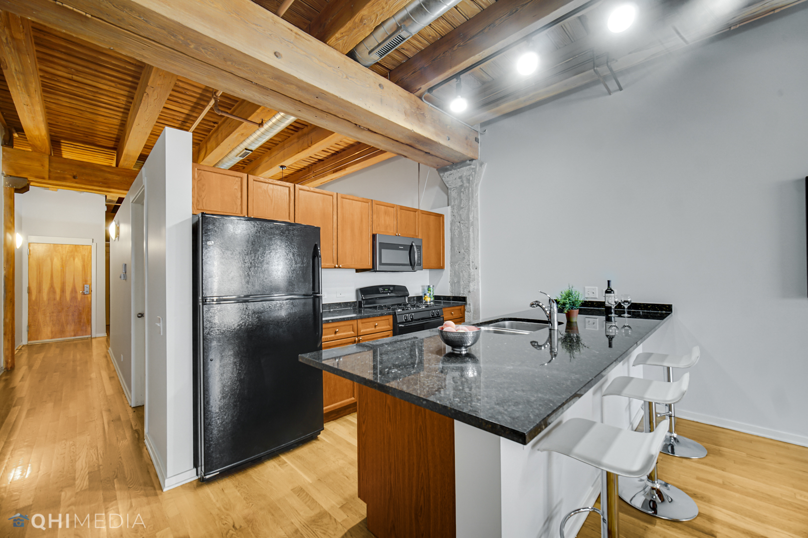 333 South Desplaines Street, Unit 314 Chicago, IL 60661 - Photo 8 of 22 a kitchen with refrigerator and car