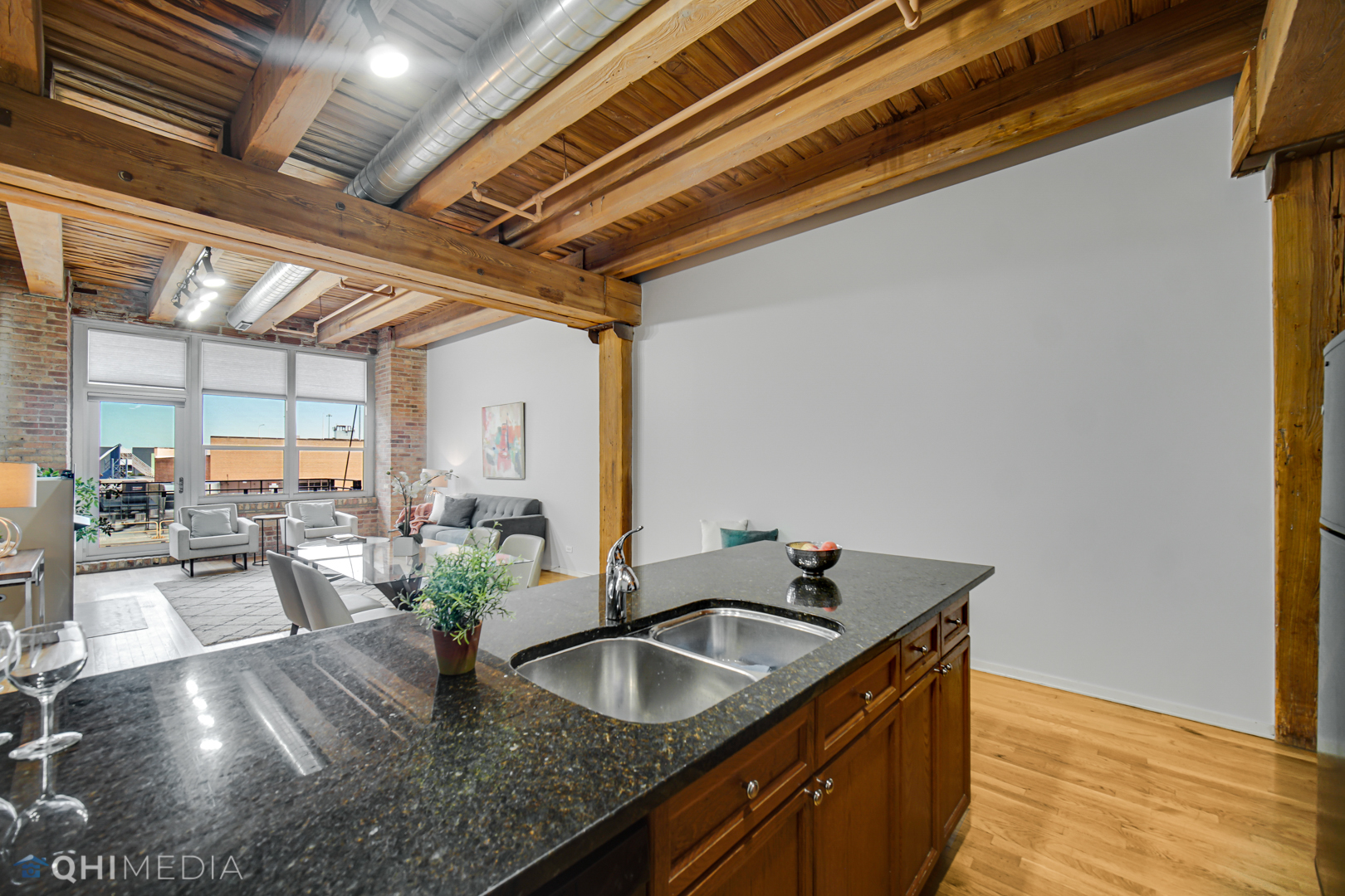 333 South Desplaines Street, Unit 314 Chicago, IL 60661 - Photo 10 of 22 a kitchen with sink stove and cabinets