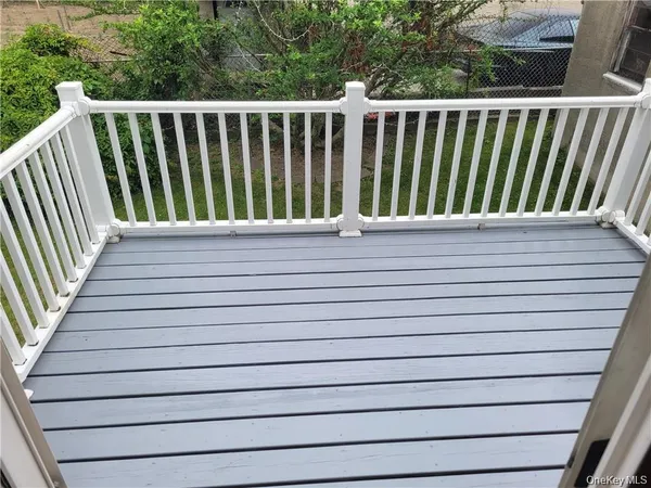 a view of house with backyard