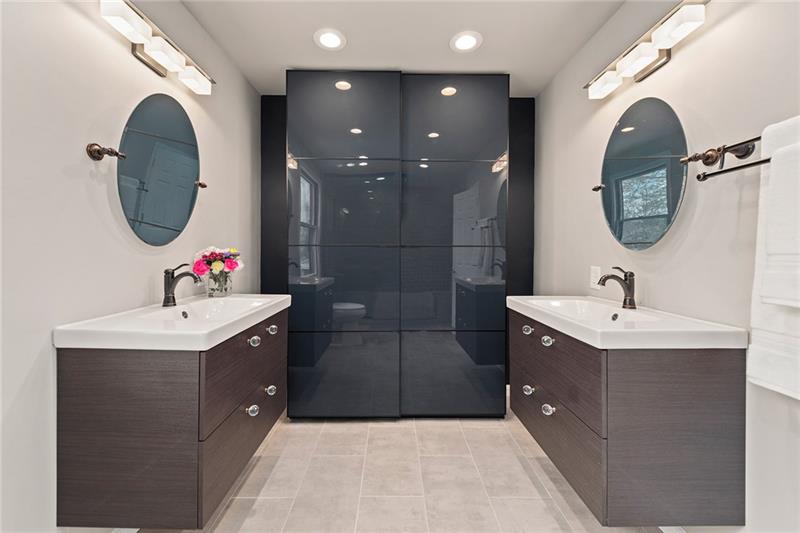 1094 Silver Lane McKees Rocks, PA 15136 - Photo 14 of 25 Double floating vanities and built-in storage give extra storage space for two.