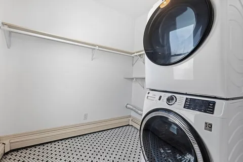 a view of a storage & utility room with a washer dryer
