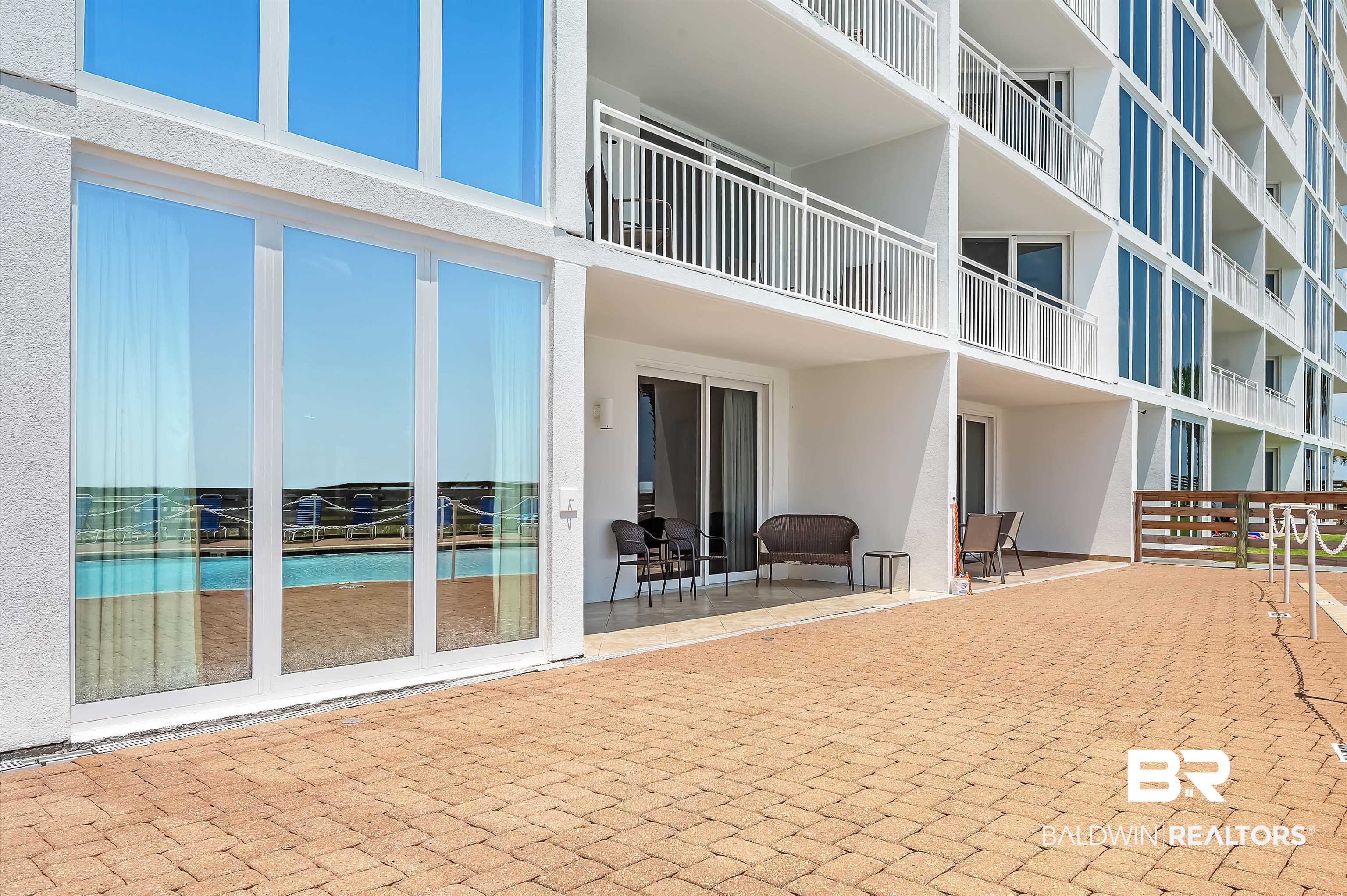 16287 Perdido Key Drive, Unit 105 Pensacola, FL 32507 - Photo 40 of 66 Expansive paver patio offering direct access to the building's exterior