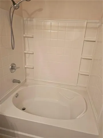 a close up of a bathtub in a bathroom