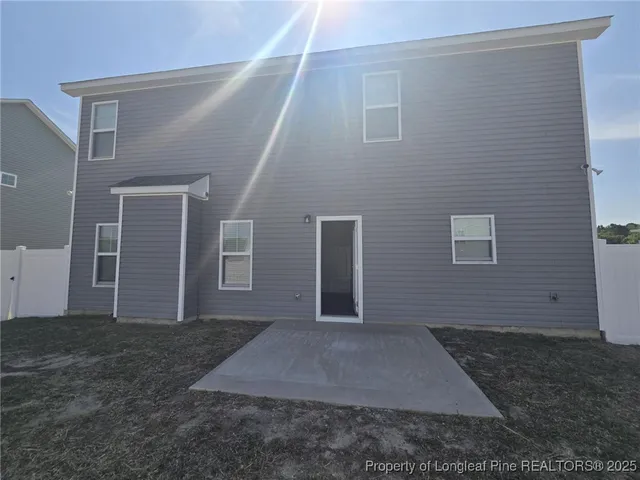 a view of a house with backyard
