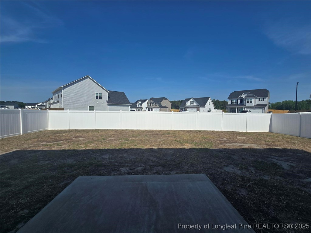 604 Amusement Drive Hope Mills, NC 28348 - Photo 19 of 41 a view of a house with a yard