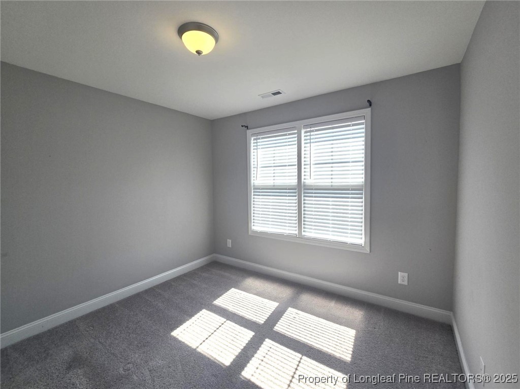 604 Amusement Drive Hope Mills, NC 28348 - Photo 28 of 41 a view of an empty room with a window