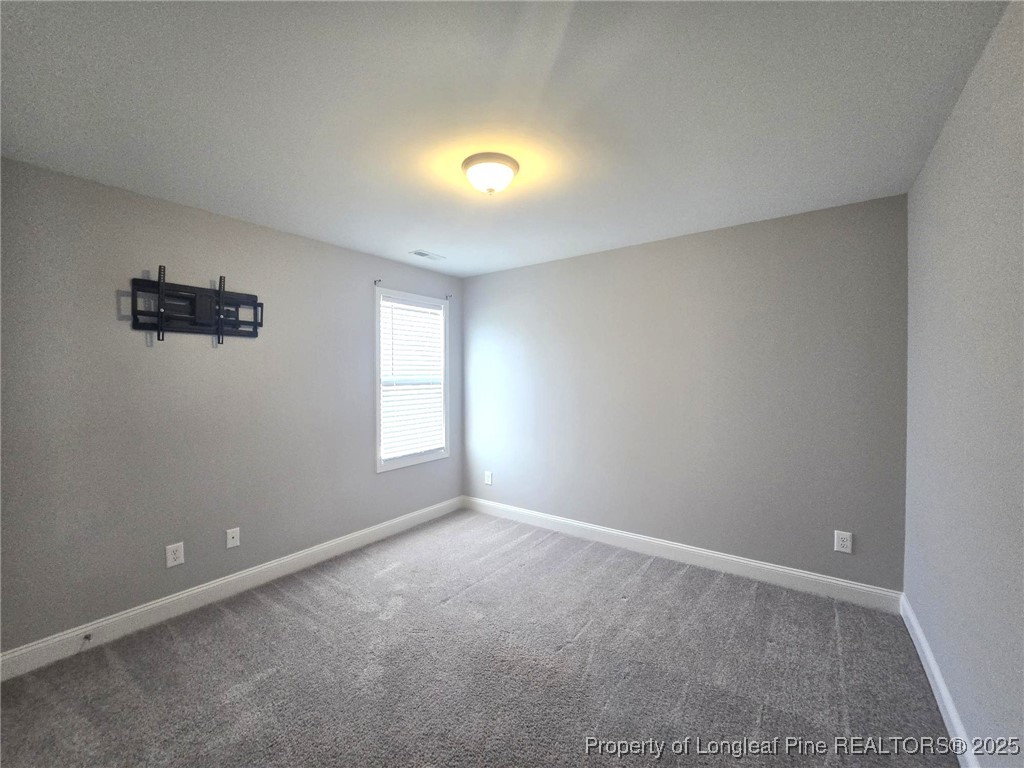 604 Amusement Drive Hope Mills, NC 28348 - Photo 30 of 41 a view of an empty room with a window