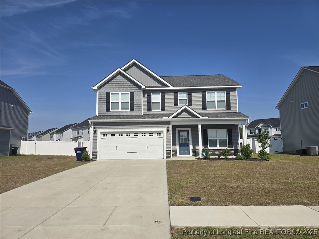 604 Amusement Drive Hope Mills, NC 28348 - Photo 3 of 41 a front view of a house with a yard