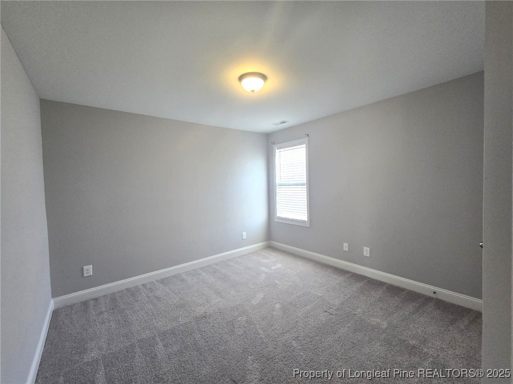 604 Amusement Drive Hope Mills, NC 28348 - Photo 34 of 41 a view of an empty room with a window