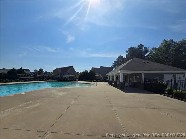 a view of house with outdoor space and lake view