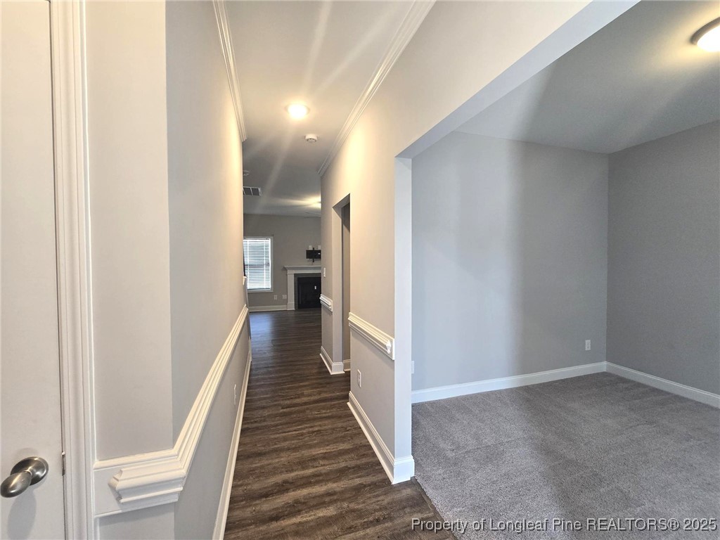 604 Amusement Drive Hope Mills, NC 28348 - Photo 5 of 41 a view of a hallway with wooden floor
