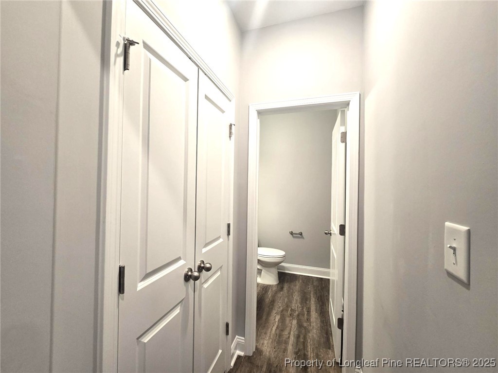 604 Amusement Drive Hope Mills, NC 28348 - Photo 7 of 41 a bathroom with a granite countertop sink a toilet and shower