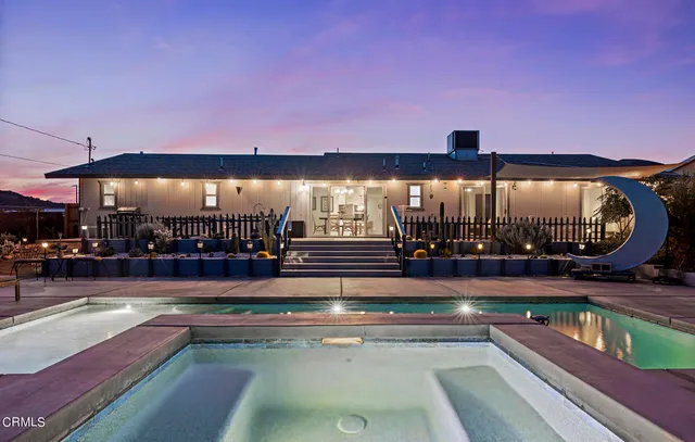 a view of swimming pool with outdoor seating