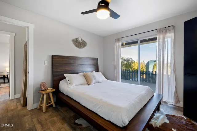 a bathroom with a granite countertop sink and mirror