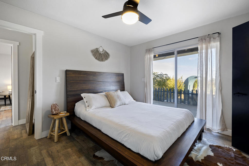4741 Avenida Del Sol Joshua Tree, CA 92252 - Photo 23 of 52 a bedroom with a bed and a table
