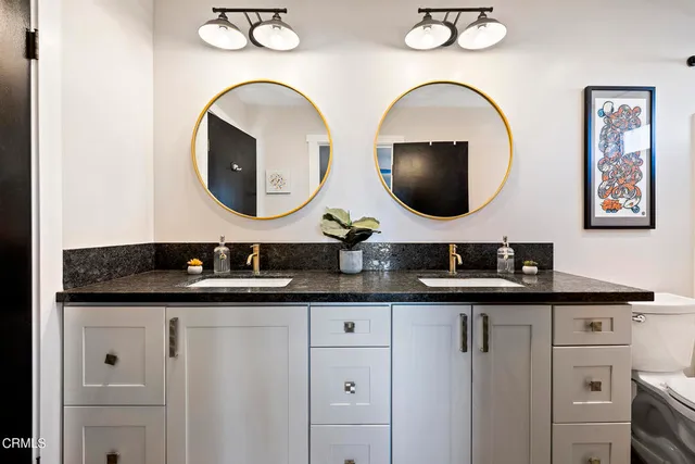 a en suite bathroom with a sink and a mirror