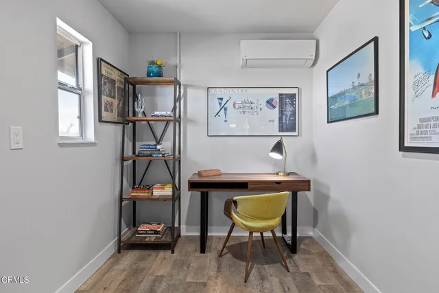 a view of a hallway with seating space