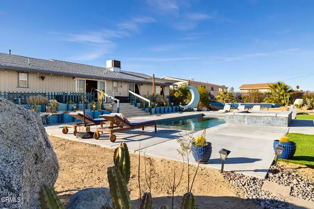 a view of a swimming pool from a terrace
