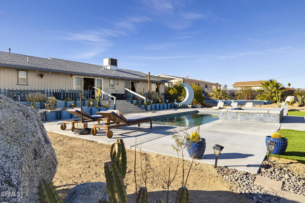 4741 Avenida Del Sol Joshua Tree, CA 92252 - Photo 32 of 52 a view of a swimming pool with outdoor seating