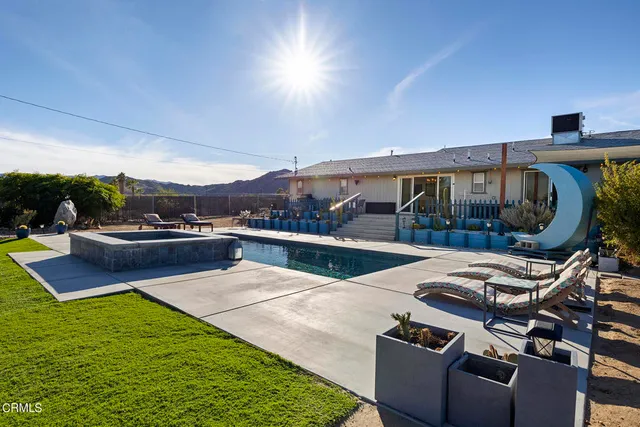 a view of a lake with chairs