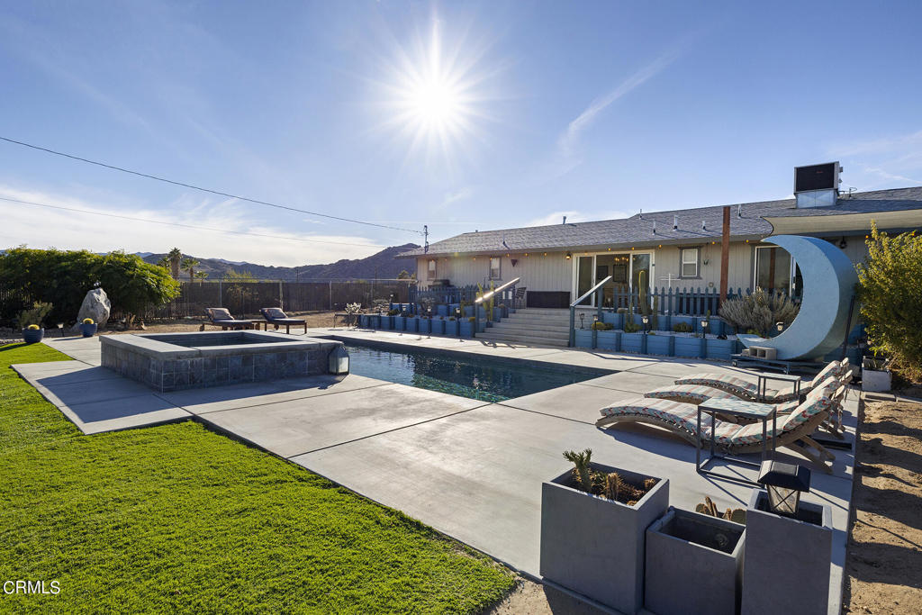 4741 Avenida Del Sol Joshua Tree, CA 92252 - Photo 33 of 52 a view of a patio with swimming pool