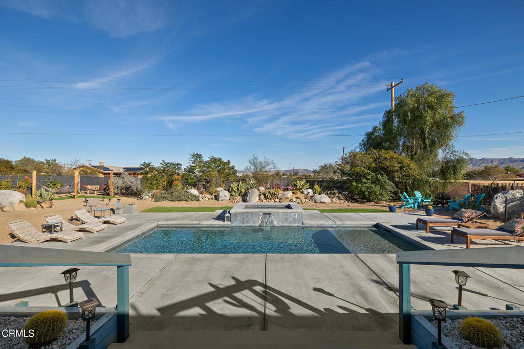 4741 Avenida Del Sol Joshua Tree, CA 92252 - Photo 34 of 52 a view of a swimming pool from a terrace