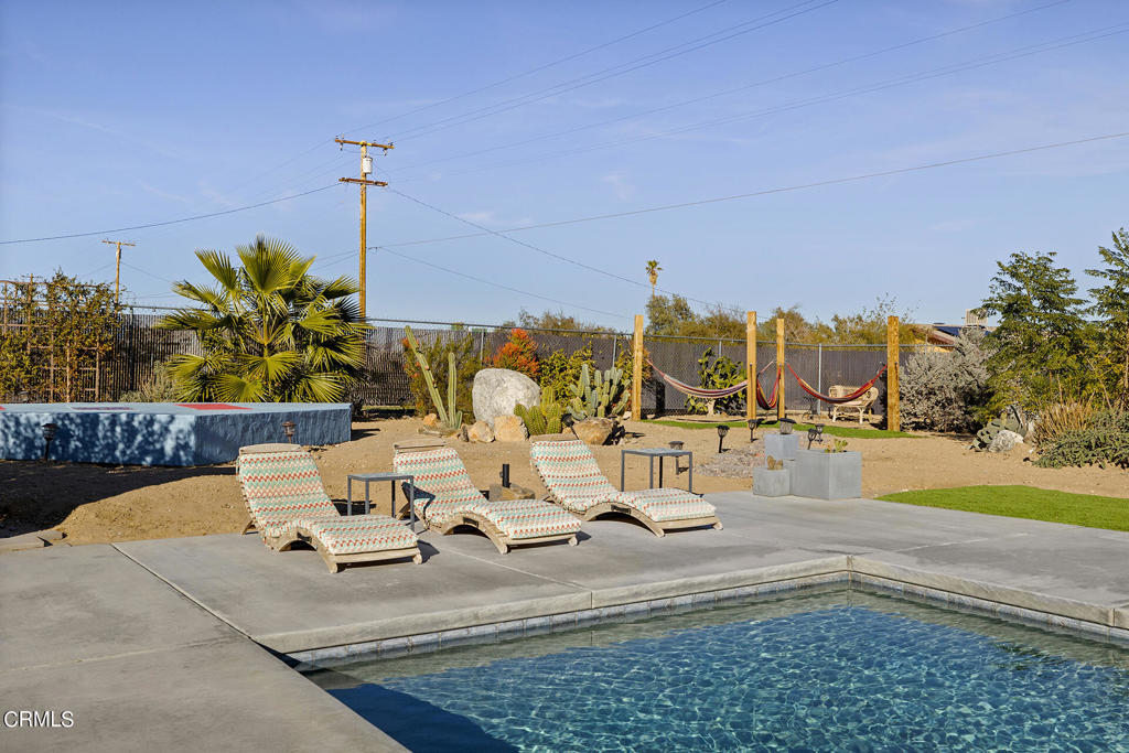 4741 Avenida Del Sol Joshua Tree, CA 92252 - Photo 35 of 52 a view of a lake with chairs