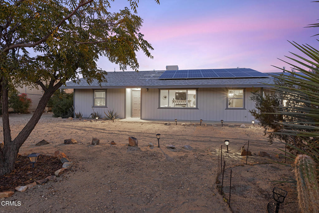 4741 Avenida Del Sol Joshua Tree, CA 92252 - Photo 40 of 52 a view of a house with backyard and chairs