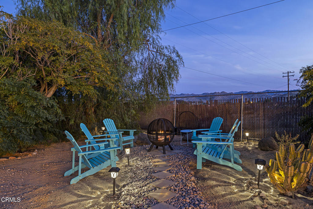 4741 Avenida Del Sol Joshua Tree, CA 92252 - Photo 48 of 52 a view of a chairs and table in patio