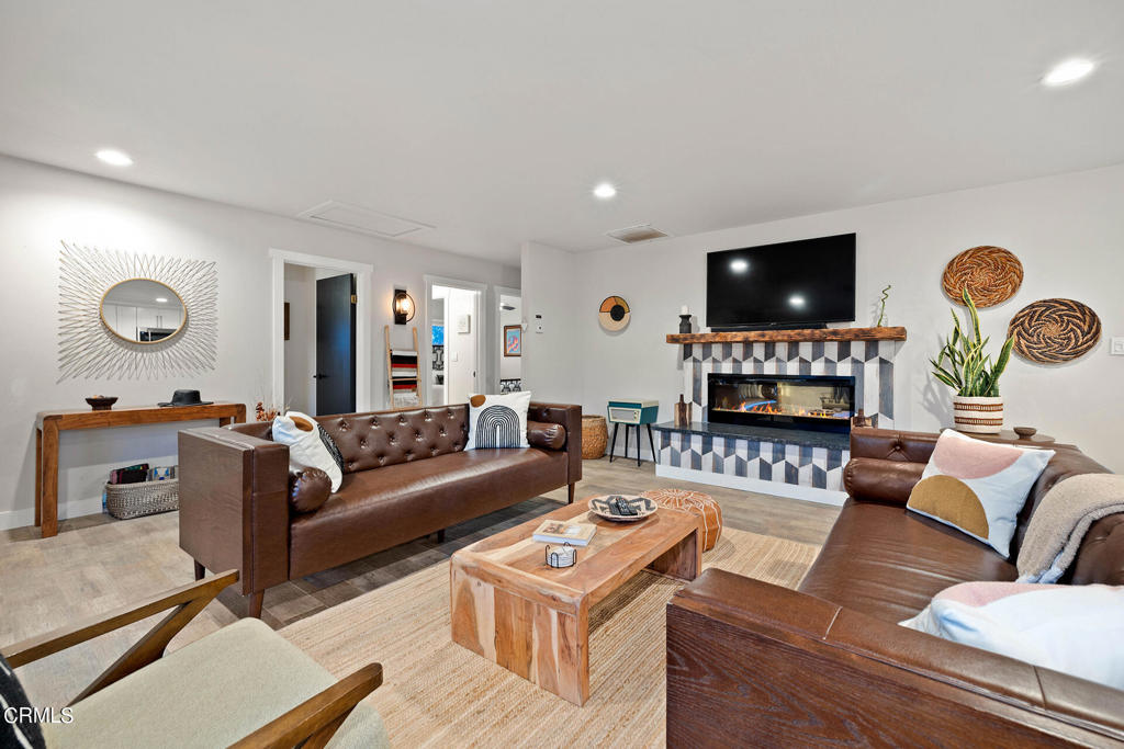 4741 Avenida Del Sol Joshua Tree, CA 92252 - Photo 10 of 52 a living room with furniture a flat screen tv and a window
