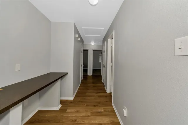 a bathroom with a sink toilet vanity and shower
