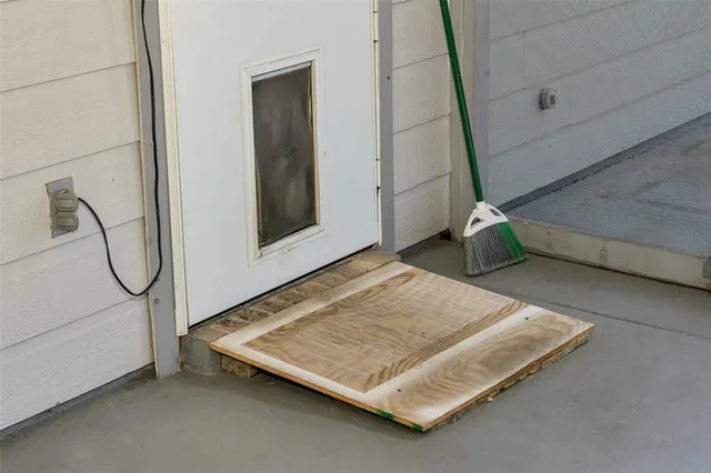 a view of an entryway with wooden floor