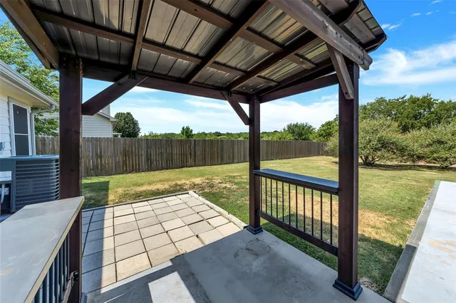 a view of a swimming pool with an outdoor space and seating area
