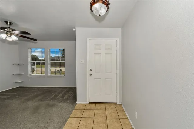 a view of a kitchen with a sink and cabinets