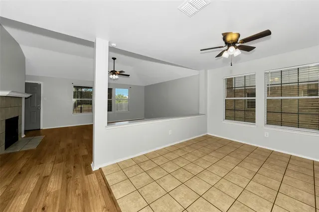 a kitchen with granite countertop a refrigerator and a sink