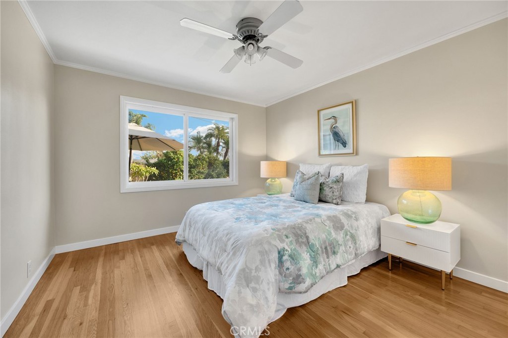 622 Linden Way Brea, CA 92821 - Photo 12 of 19 a bedroom with a bed and a chandelier