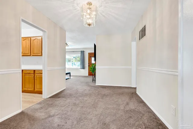 a room with a dresser and a mirror