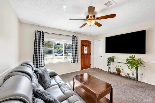 a living room with a couch and a flat screen tv