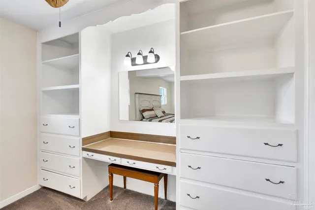 a bathroom with a sink and a window