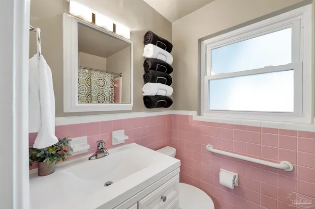 a view of an empty room with many windows