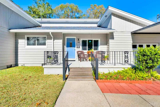 a view of a swimming pool with a patio