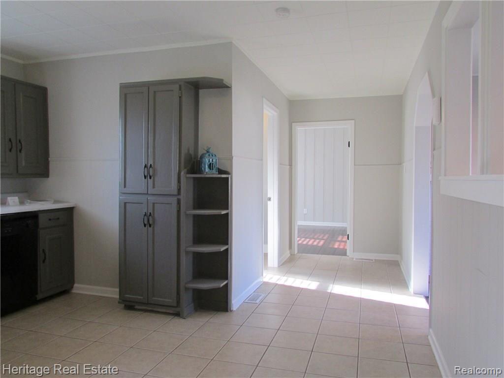 Nice wide open hallway featuring lots of light and space